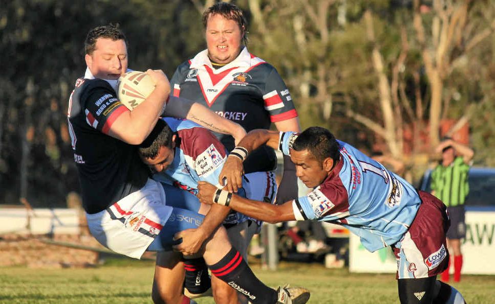 Cowboys player Nick Baker is powerless as team-mate Garry Hanson is tackled by Boars players Derrick Craigie and Stephen Edwards during their reserve-grade game. Cowboys player Nick Baker is powerless as team-mate Garry Hanson is tackled by Boars players Derrick Craigie and Stephen Edwards during their reserve-grade game.